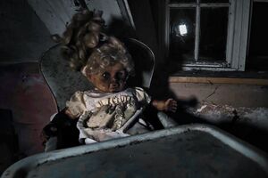Creepy doll in high chair